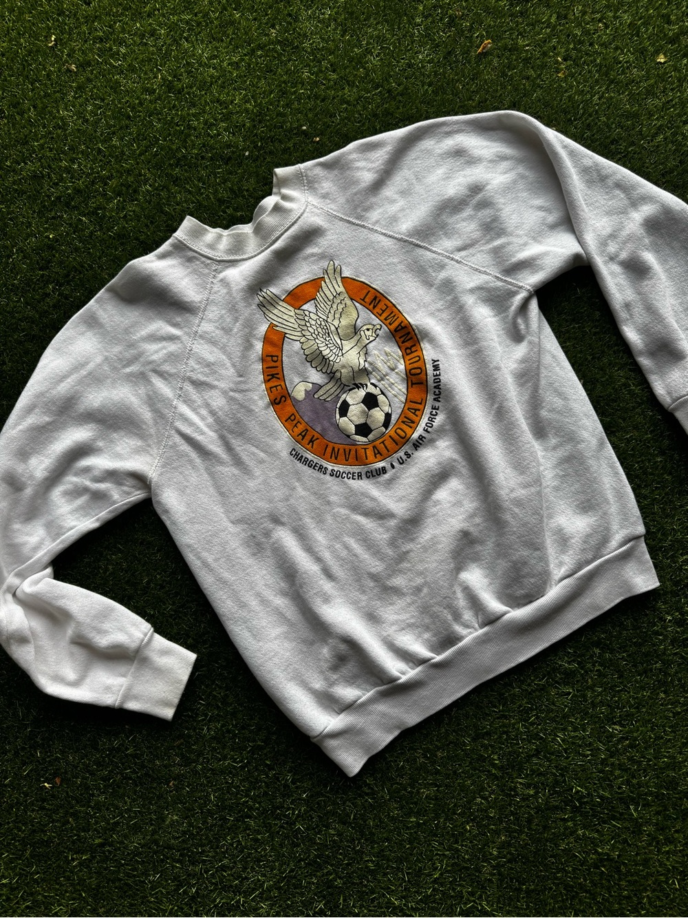 White Crewneck Sweatshirt with pikes Peak Air Force Soccer Crest & Dove Graphic